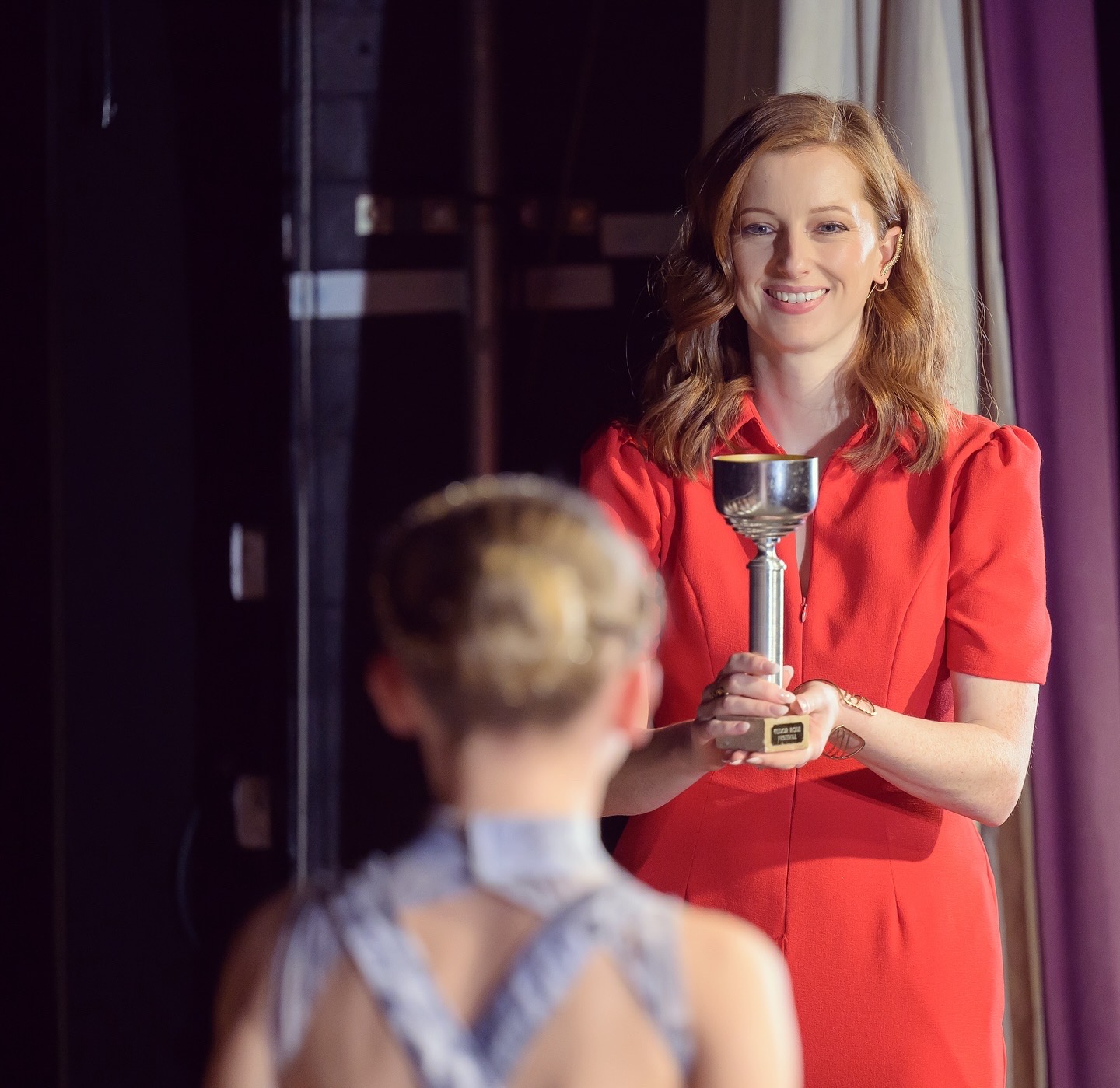 Anna Morgan presenting an award to a dancer